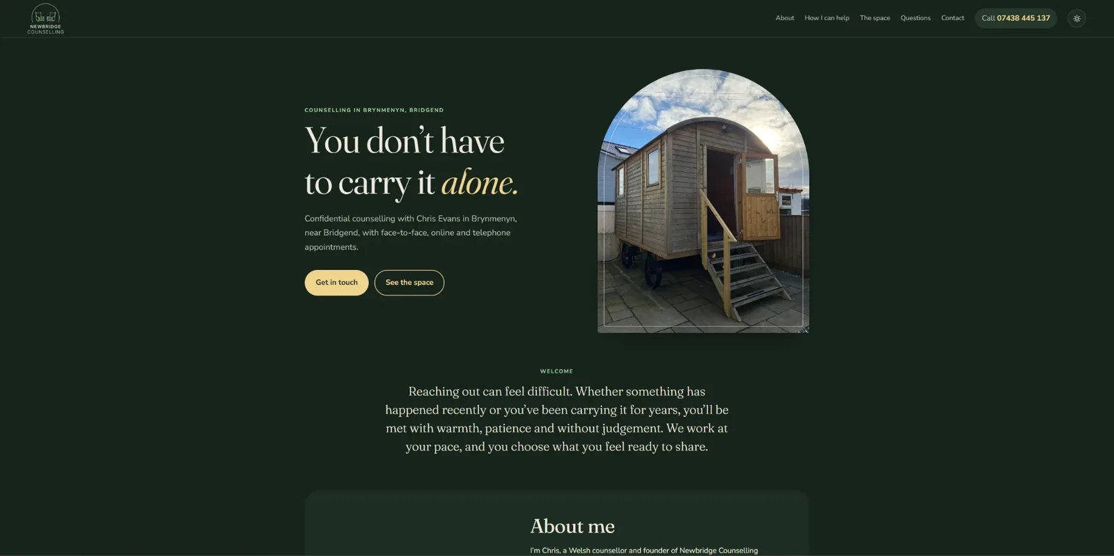 Newbridge Counselling's front page: You don't have to carry it alone, in cream and gold on deep green, beside an arched photo of the shepherd's hut where sessions happen.